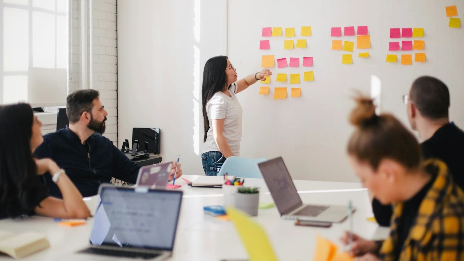 A business team collaborating, illustrating customer management and sales workflows.