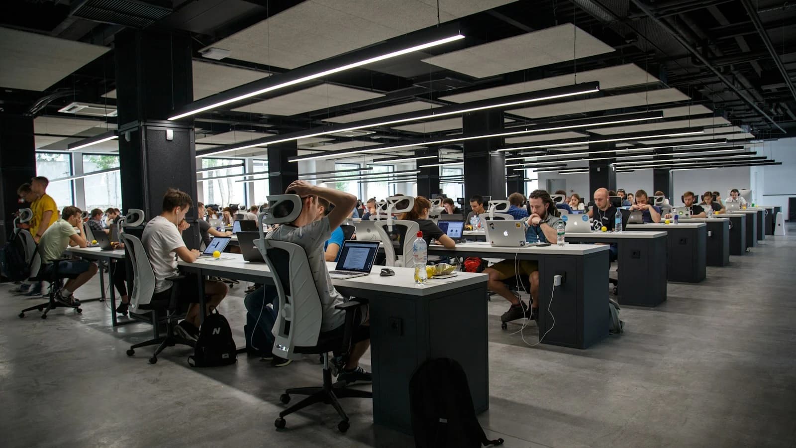 A modern collaborative workspace illustrating the evolution of business tools and working practices.
