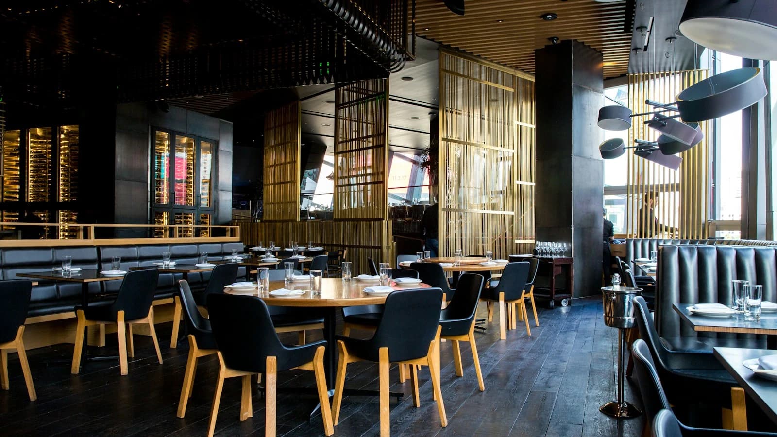 A warmly lit restaurant dining room illustrating hospitality and table service.